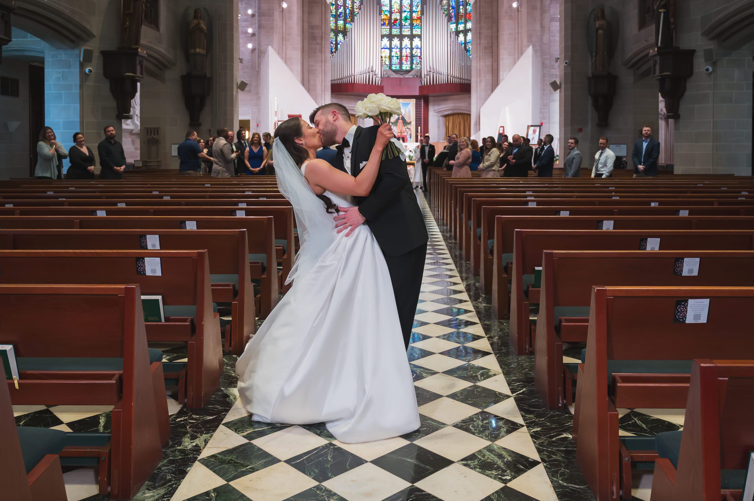 The newlyweds walk joyfully back down the aisle after being pronounced married.